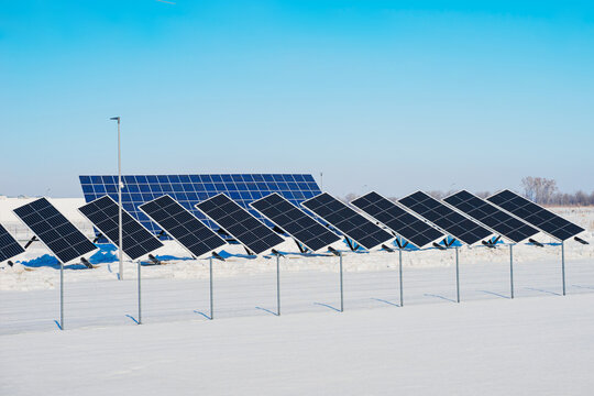 Solar panes in a solar park used for clean energy production. Photovoltaic power plant in winter.