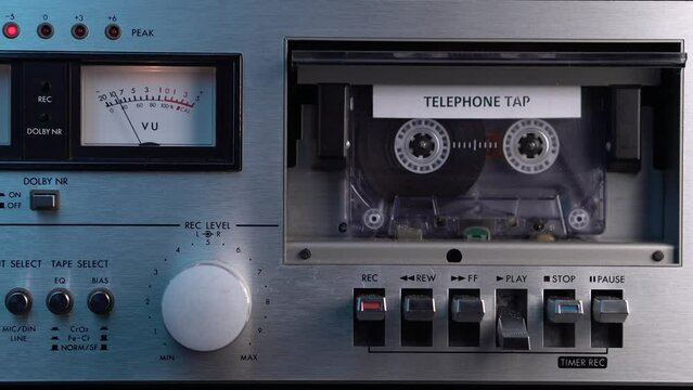 Telephone Tap Audio Recording on Cassette Tape in Vintage Deck Player From 1980s Close Up