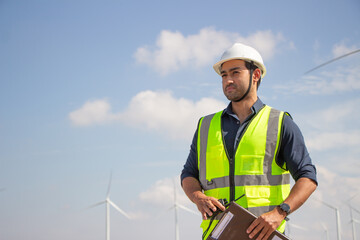 engineer team working in wind turbine farm. Renewable energy with wind generator by alternative energy concept.