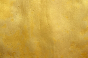 Gold color old grunge wall concrete texture as background.