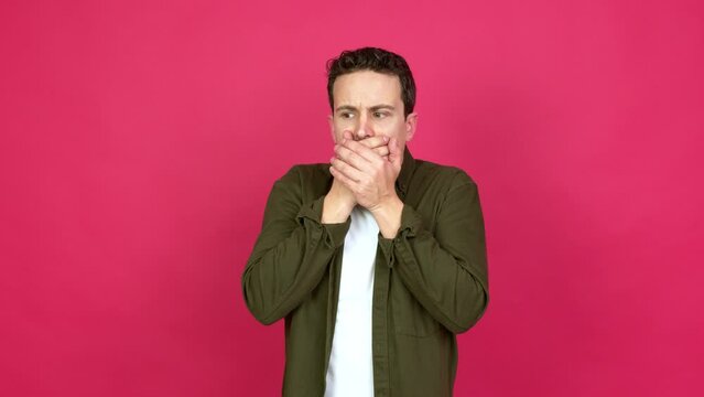 Man covering mouth with hands. Can not speak over isolated background