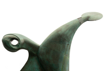 silhouetted statue against the sky in the city of bilbao