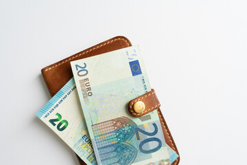 Money in the dockholder. Two banknotes of 20 euros in a wallet.