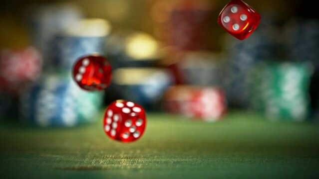 Super slow motion of rolling gaming dices on poker table. Filmed on high speed cinema camera, 1000fps. Speed ramp effect.