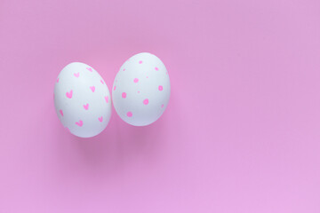 Easter layout. Decorated eggs against a pink background. Easter card. Decorate. Congratulate. Pink monochrome.