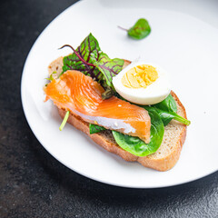 sandwich egg salmon smorrebrod green salad mix seafood open fresh portion meal food snack on the table copy space food background 