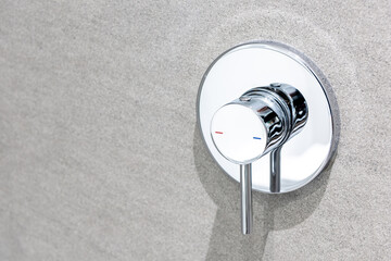Silver hot and cold modern chrome shower handle valve in bathroom wall