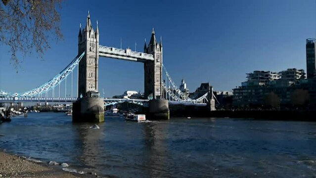 Boats flowing into and out of London under the Tower Bridge, London, United Kingdom