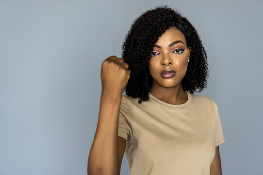 African Woman Doing Punch Gesture Isolated On Gray Background