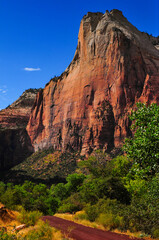 Naklejka premium Abraham Peak, of the Court of the Patriarchs, towering above the Scenic Drive through the canyon of the Virgin River, Zion National Park, Utah, Southwest USA