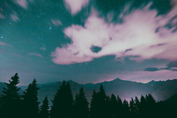 Milky way Stars in the night sky with silhouettes of mountains in the background