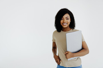 Portrait of happy young afro american woman using laptop computer isolated over white background