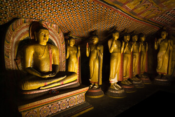 Fototapeta premium Buddha statues inside Dambulla cave teple complex