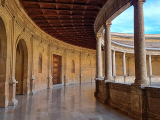 Gallery with old pillars on the outside square of the Alhambra in Granada, Spain