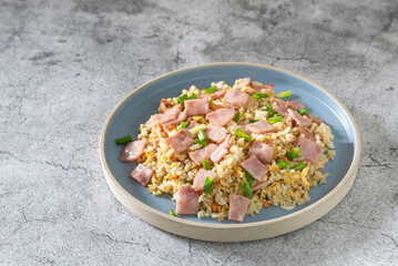Fried rice with ham as lunch on table, simply menu