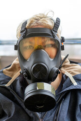 A woman with a gas mask on her face