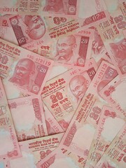 Twenty rupees notes overlapped on each other. HD twenty rupees notes background for finance and cash purposes. 