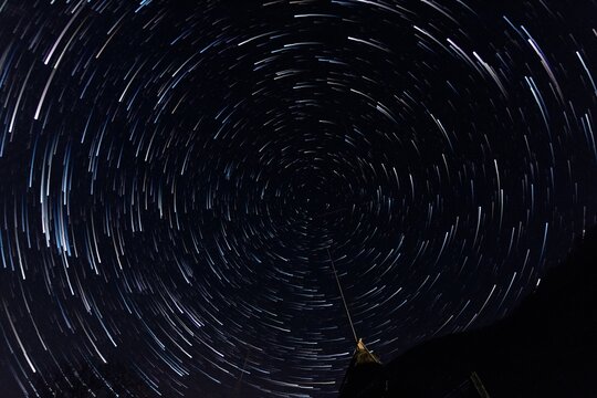 Radial startails around the North Star. Polar Star. Night clear sky. Long exposure photo.