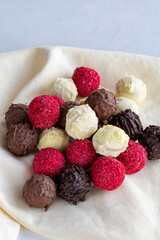 Truffle chocolate assortment on a white background. homemade chocolate pralines. close up