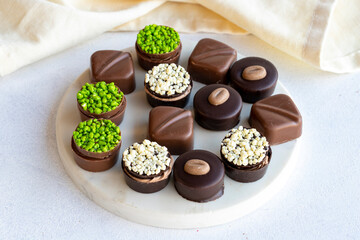 Assorted chocolates on a white background. assorted chocolate pralines. close up