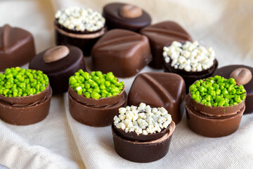 Assorted chocolates on a white background. assorted chocolate pralines. close up