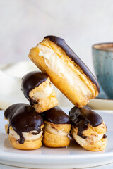 Chocolate eclairs cake on a white background. close up