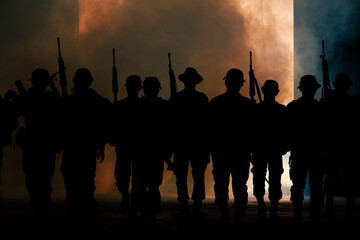 silhouette group of thai soldiers special forces full team in uniform walking action through smoke...
