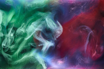 Green pink smoke on black ink background, colorful fog, abstract swirling touch ocean sea, acrylic paint pigment underwater