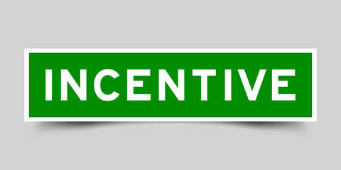 Sticker label with word incentive in green color on gray background