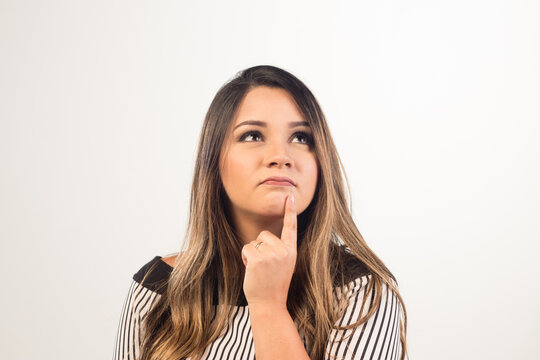 White Latina Girl Thinking On The White Background