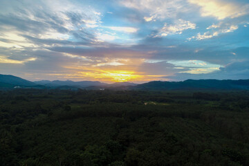 Aerial view mountain sunrise in tropical forest with cloud