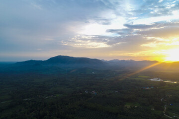 Aerial view mountain sunrise in tropical forest with cloud