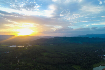 Aerial view mountain sunrise in tropical forest with cloud