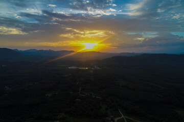 Aerial view mountain sunrise in tropical forest with cloud