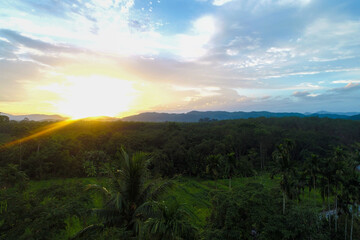 Aerial view mountain sunrise in tropical forest with cloud