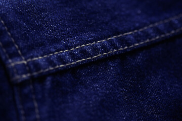 Naklejka premium Blue Jeans denim texture close up , focus only one point , soft blured background wallpaper