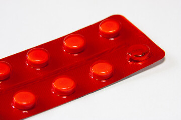 medicinal pills and capsules in blisters close-up. macro shooting of multicolored pills of...