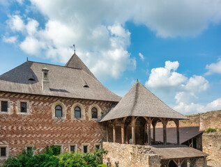 Fototapeta premium Aerial view of Khotyn medieval castle on the green hill above the river.