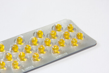 medicinal pills and capsules in blisters close-up. macro shooting of multicolored pills of different sizes