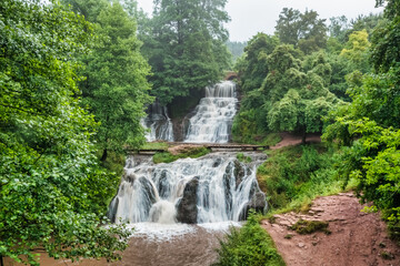 Fototapeta na wymiar Dzhurinsky or Krasnogorodsky waterfall, aerial view, located on the Dzhurin River in the village of Nyrkov, Zalishchikovsky district, Ternopil region.