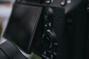 Selective focus shot of iso button of a digital camera with flip screen