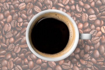 Espresso or black coffee in white cup with coffee beans.
