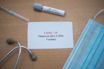 Covid19 vaccine, syringe and other medical items on a wooden table
