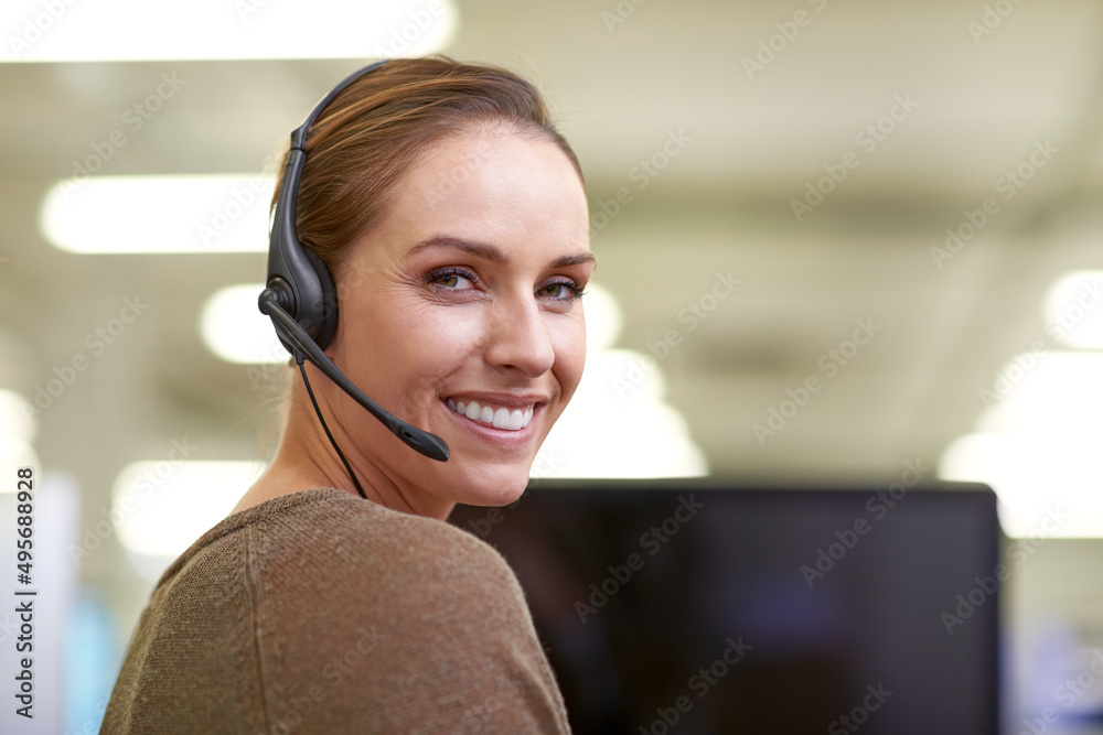 Poster She makes everyday a happy day. An attractive female worker wearing a headset.