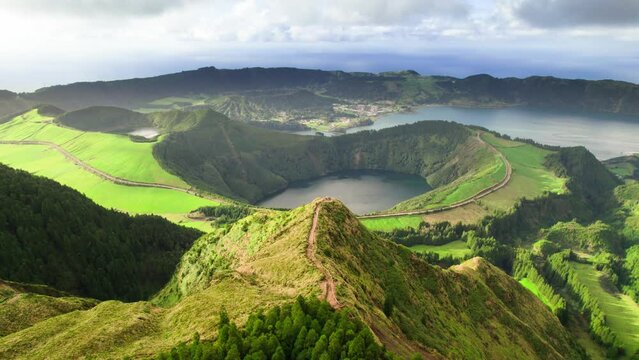 Crater lake with clear turquoise water. Aerial view of the beautiful volcanic Lagoa das Sete Cidades lake and green idyllic hills in Sao Miguel, The Azores, Portugal. 