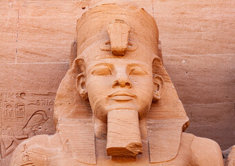 Statue of Pharaoh Ramses II in front of The Great Temple of Ramses II in the village of Abu Simbel.