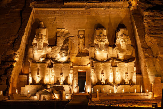 Statue of Pharaoh Ramses II in front of The Great Temple of Ramses II in Abu Simbel in the night.