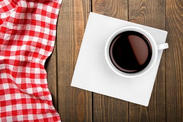 Espresso or black coffee in white cup on wooden desk