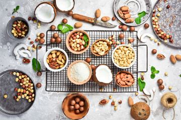 Background with nuts on a stone table. Assortment of nuts. Top revision.