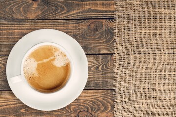 Espresso or black coffee in white cup on wooden desk